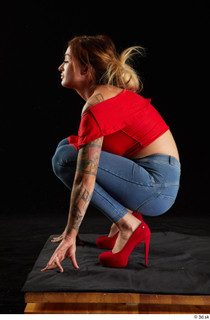 Daisy Lee 1 blue jeans dressed kneeling red high heels…